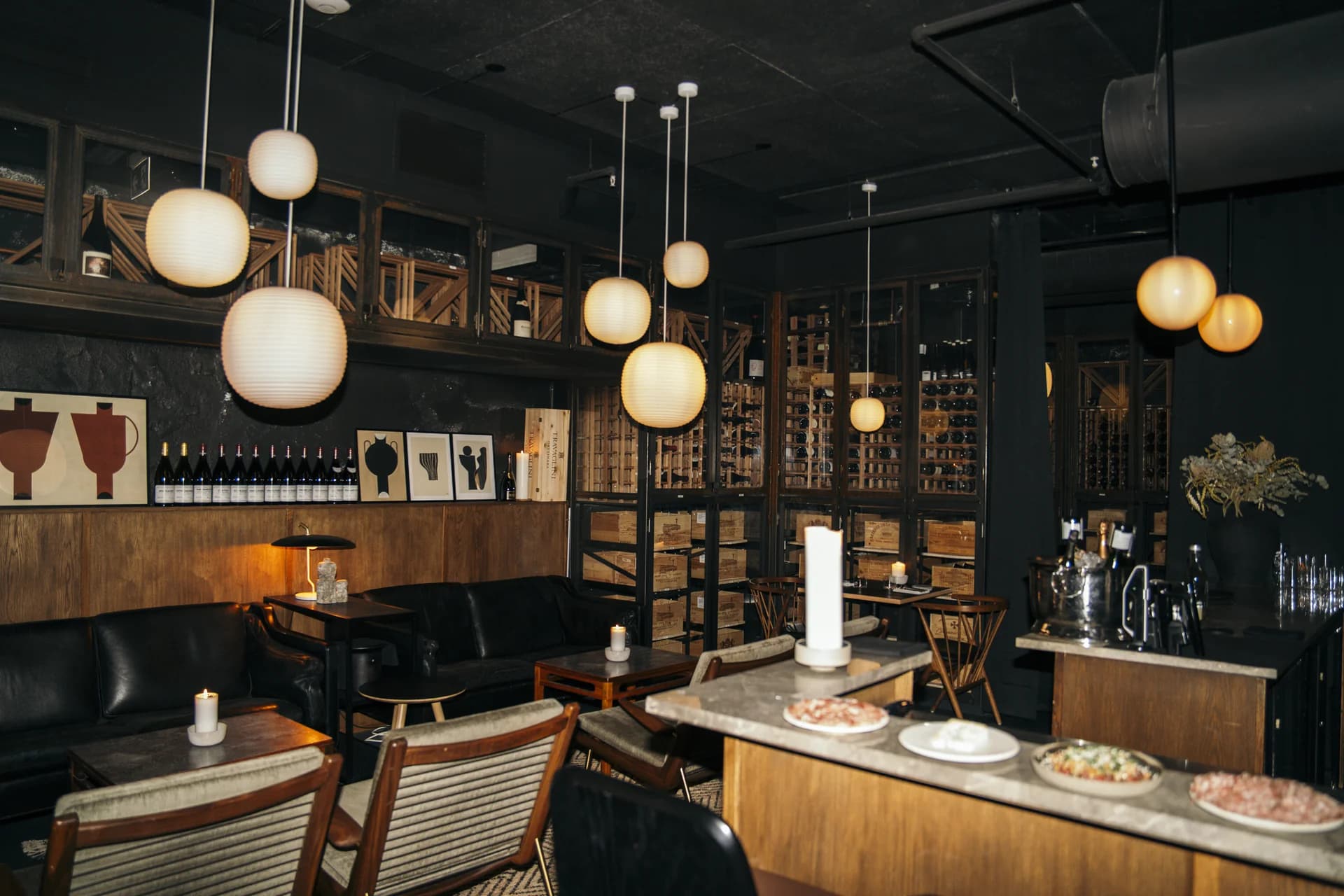 The Three Fifty lounge and bar, with leather sofas, woven chairs, and warm pendant lighting